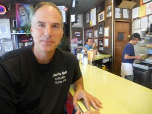 Frank DiPiero, owner, in front of a countertop with personality - Photo copyright of Dave Hoesktra~ Chicago Sun-Times